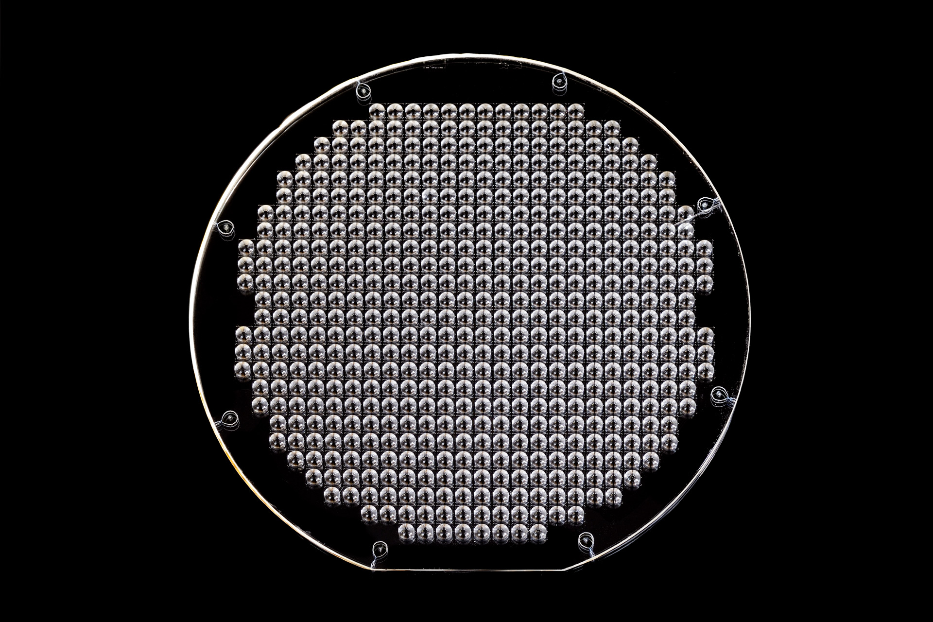 Fused silica wafer with microlenses.
